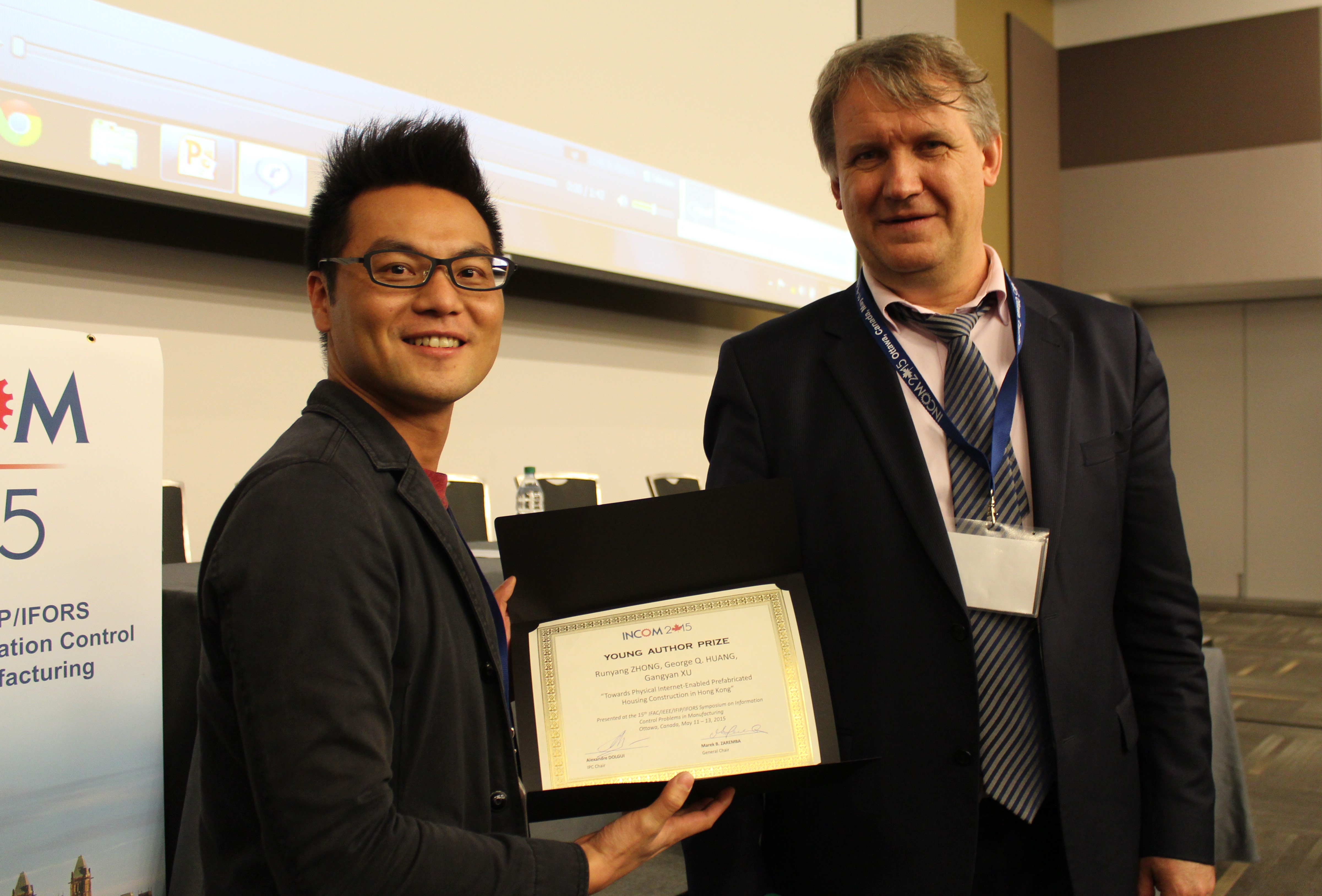 Dr Zhong (left) won the Young Author Prize at the 15th IFAC Symposium on Information Control in Manufacturing (INCOM 2015)