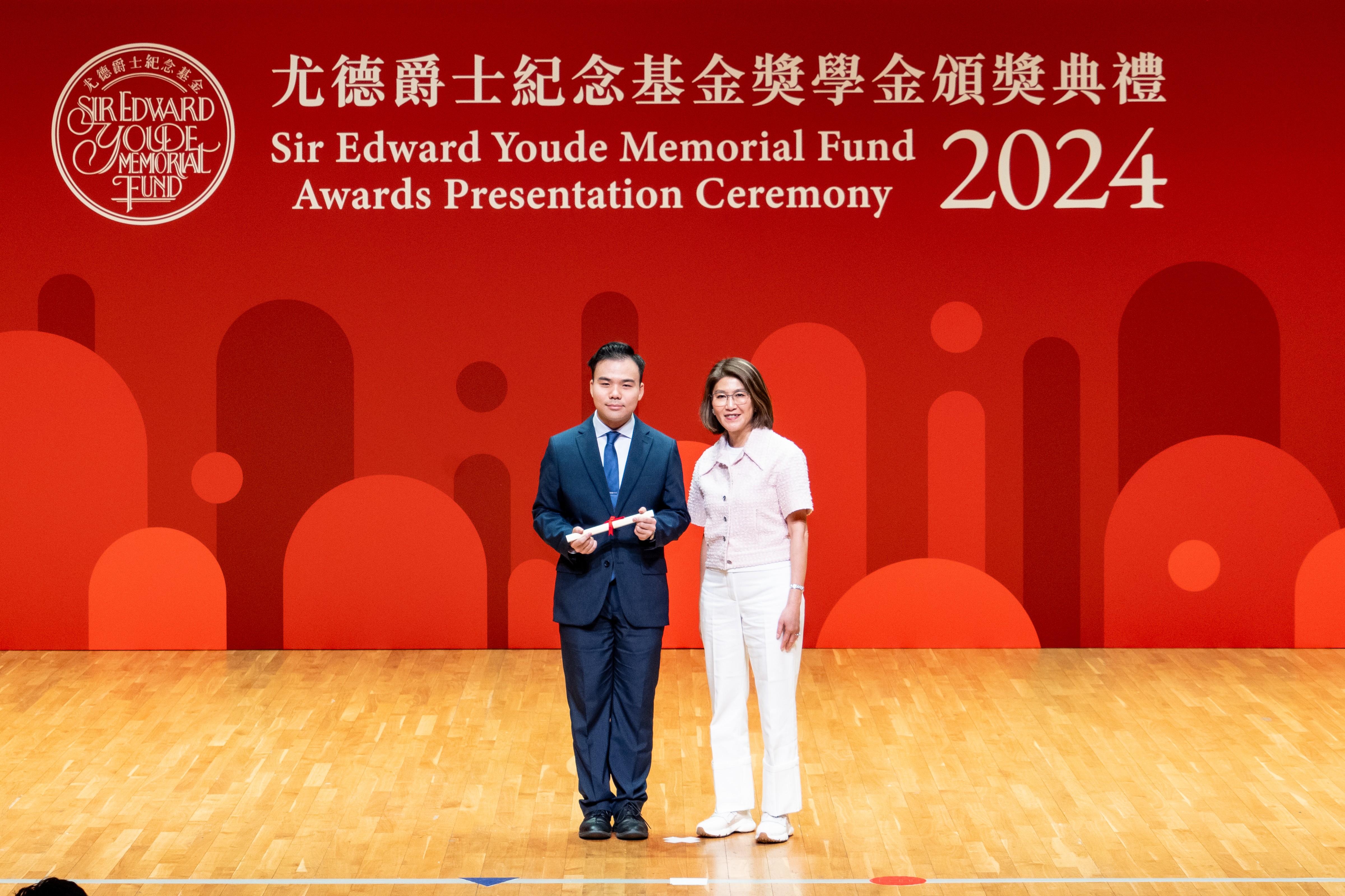 Howard (left) receiving the Sir Edward Youde Memorial Fellowship 2024.