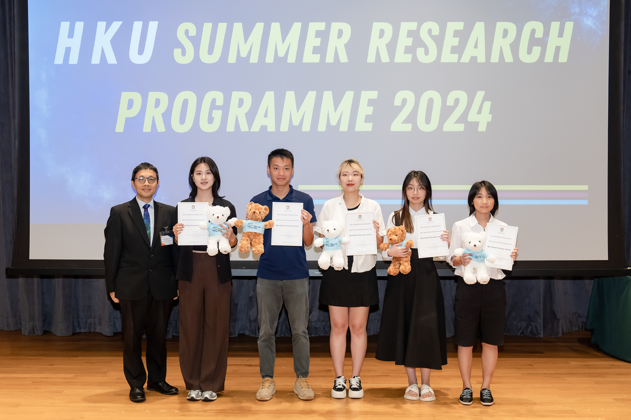 Students receiving the Best Poster Presenter Awards presented by Professor Edmund Y.M. Lam, Associate Dean of the Graduate School.