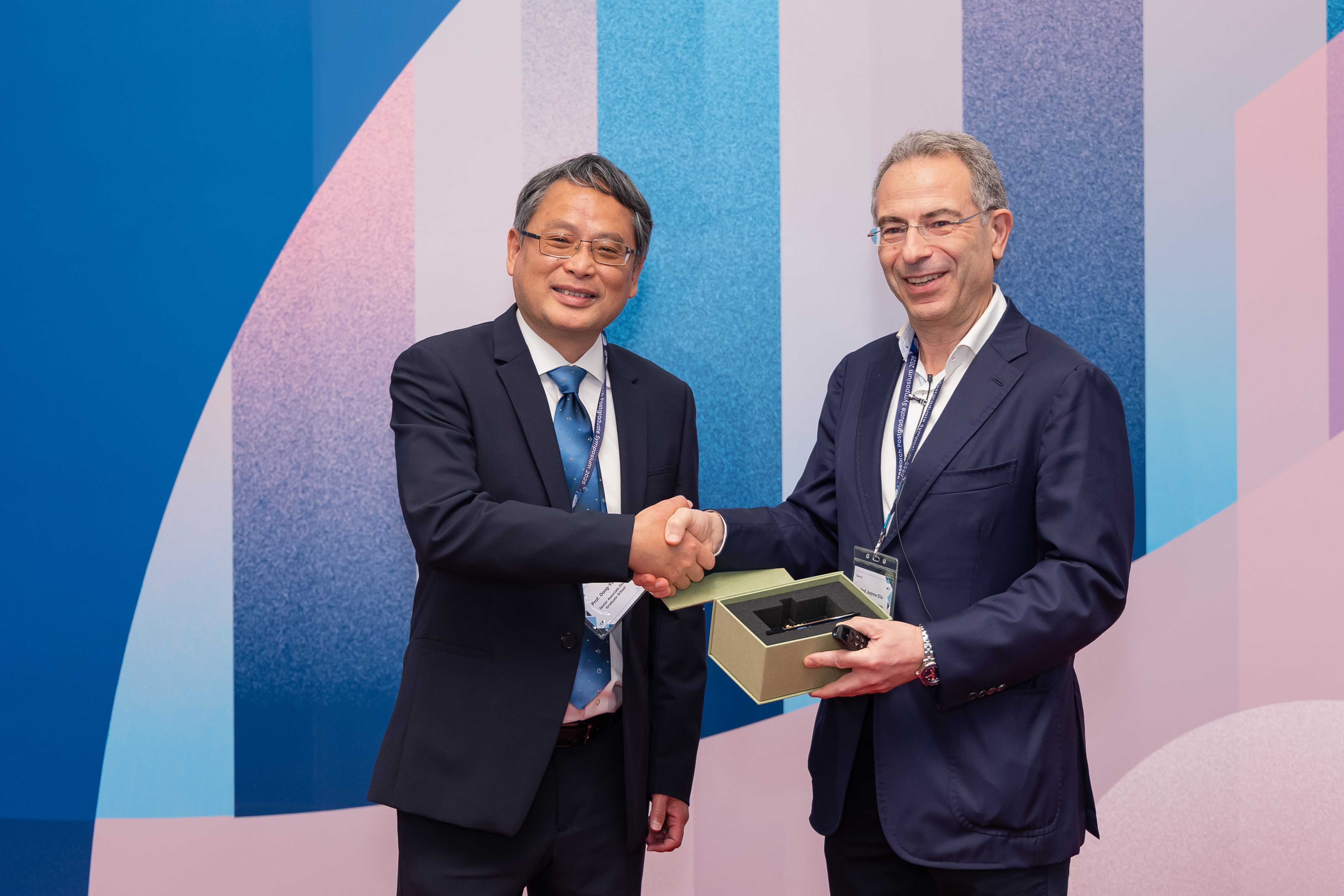 Professor Dong-Yan Jin, Senior Associate Dean of the Graduate School (left) and the keynote speaker, Professor Andrew Ellul of Kelley School of Business, Indiana University (right).