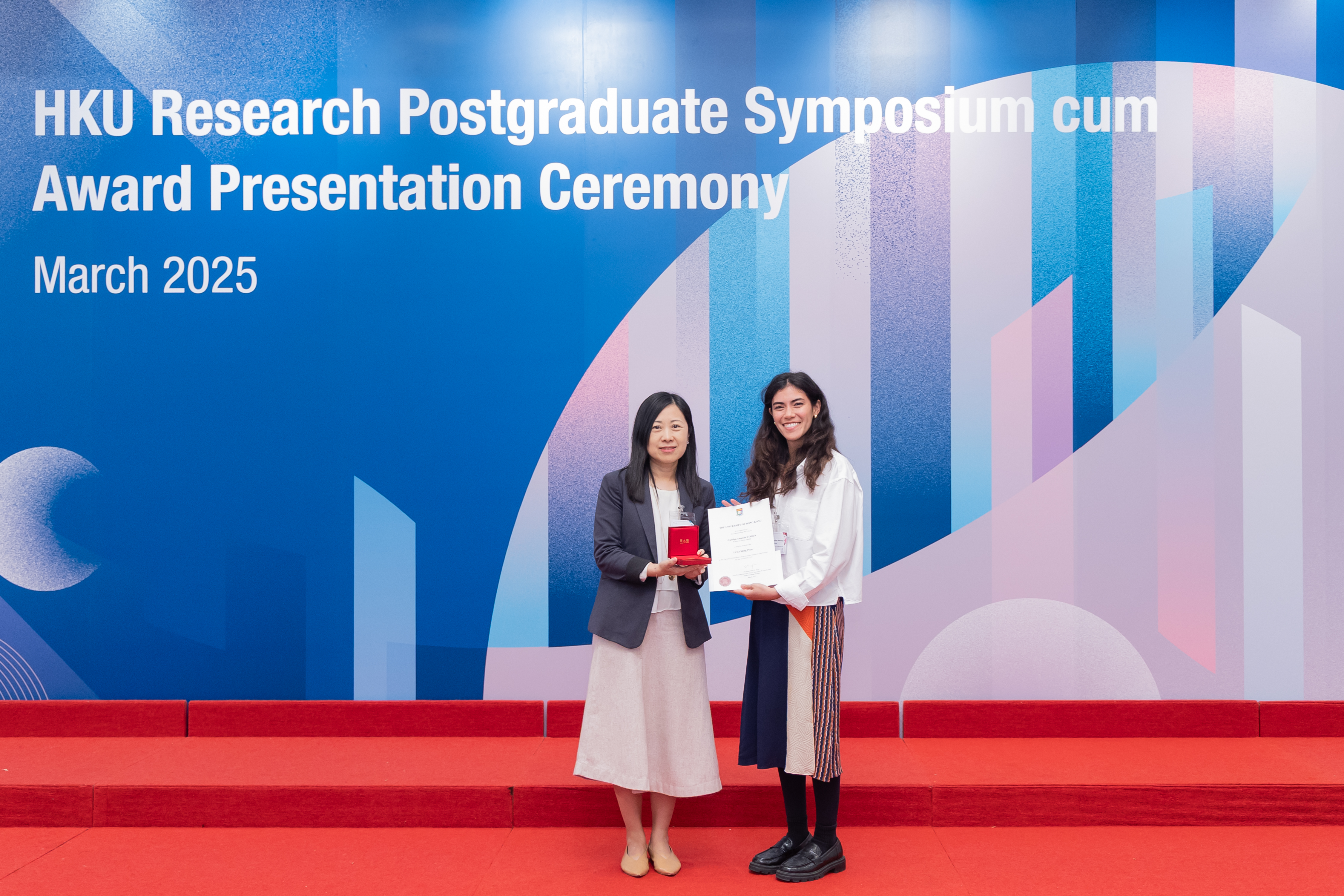 Professor Alice Wong, Associate Vice-President (Research) (left), congratulating an awardee of the Li Ka Shing Prizes 2022-23.